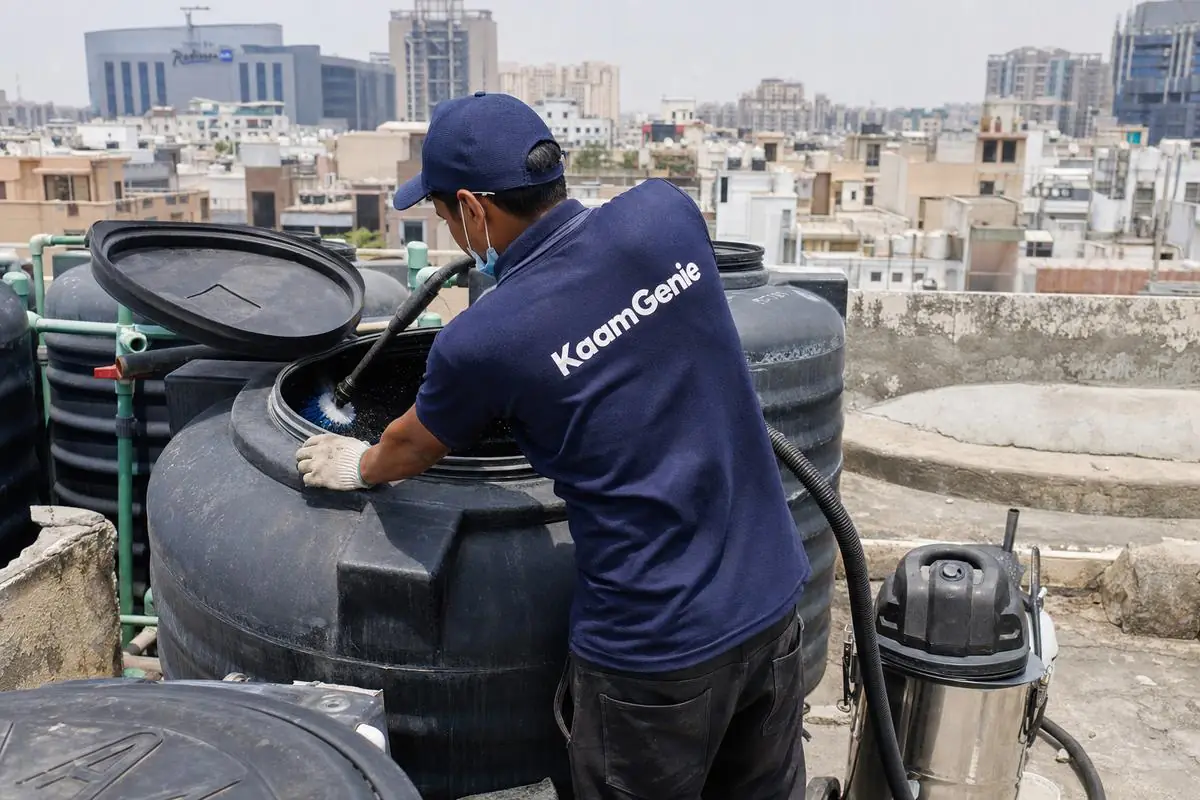 KaamGenie crew cleaning a Sintex / plastic tank in Dwarka Sector 13, Delhi