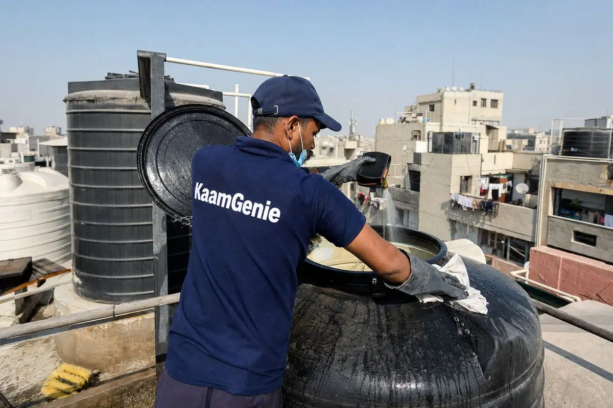 KaamGenie crew cleaning a Sintex / plastic tank in Dwarka Sector 15, Delhi
