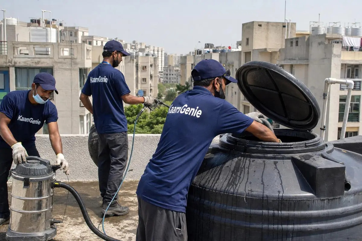 KaamGenie crew cleaning a Sintex / plastic tank in Dwarka Sector 19, Delhi