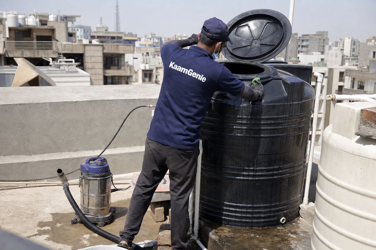 KaamGenie crew cleaning a Sintex / plastic tank in Dwarka Sector 22, Delhi