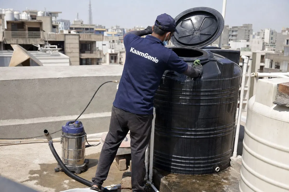 KaamGenie crew cleaning a Sintex / plastic tank in Dwarka Sector 22, Delhi