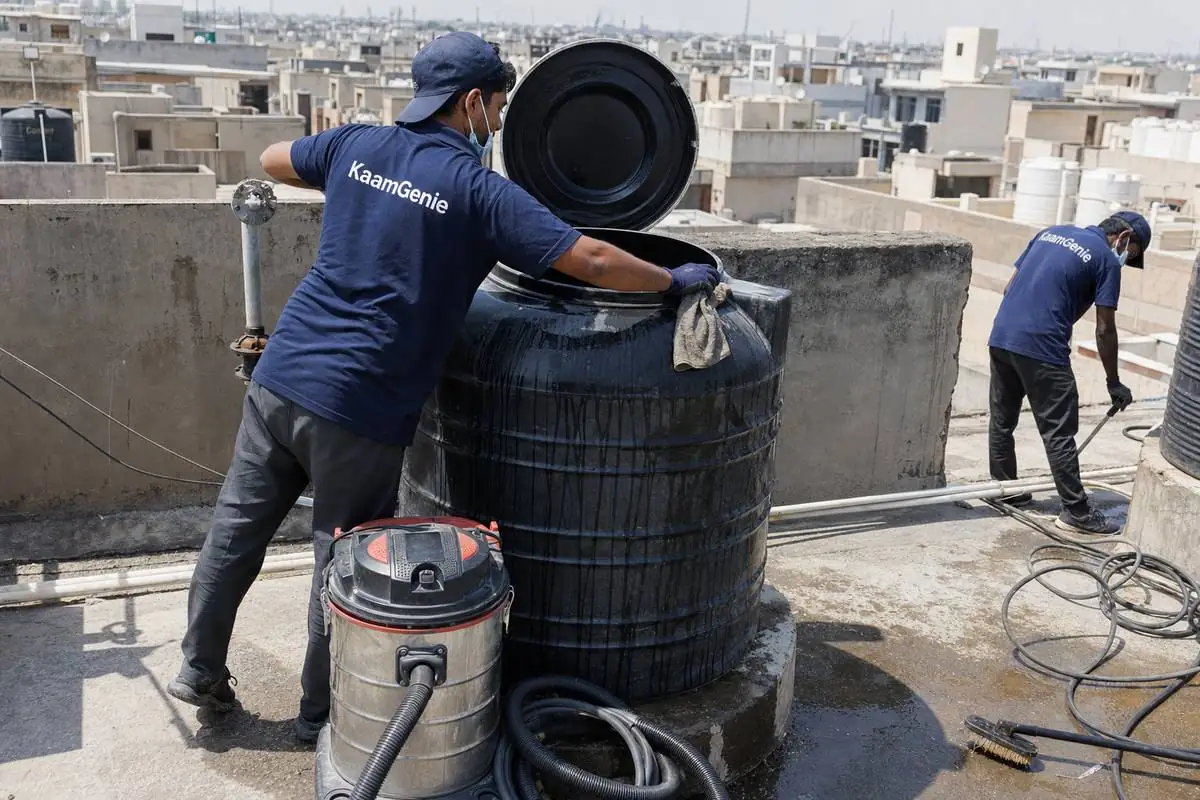 KaamGenie crew cleaning a Sintex / plastic tank in Dwarka Sector 23, Delhi