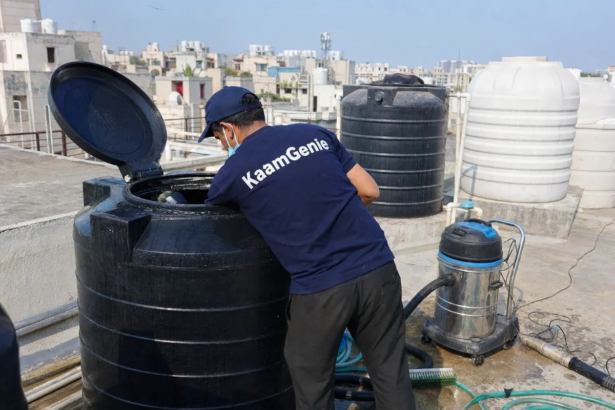 KaamGenie crew cleaning a Sintex / plastic tank in Dwarka Sector 24, Delhi