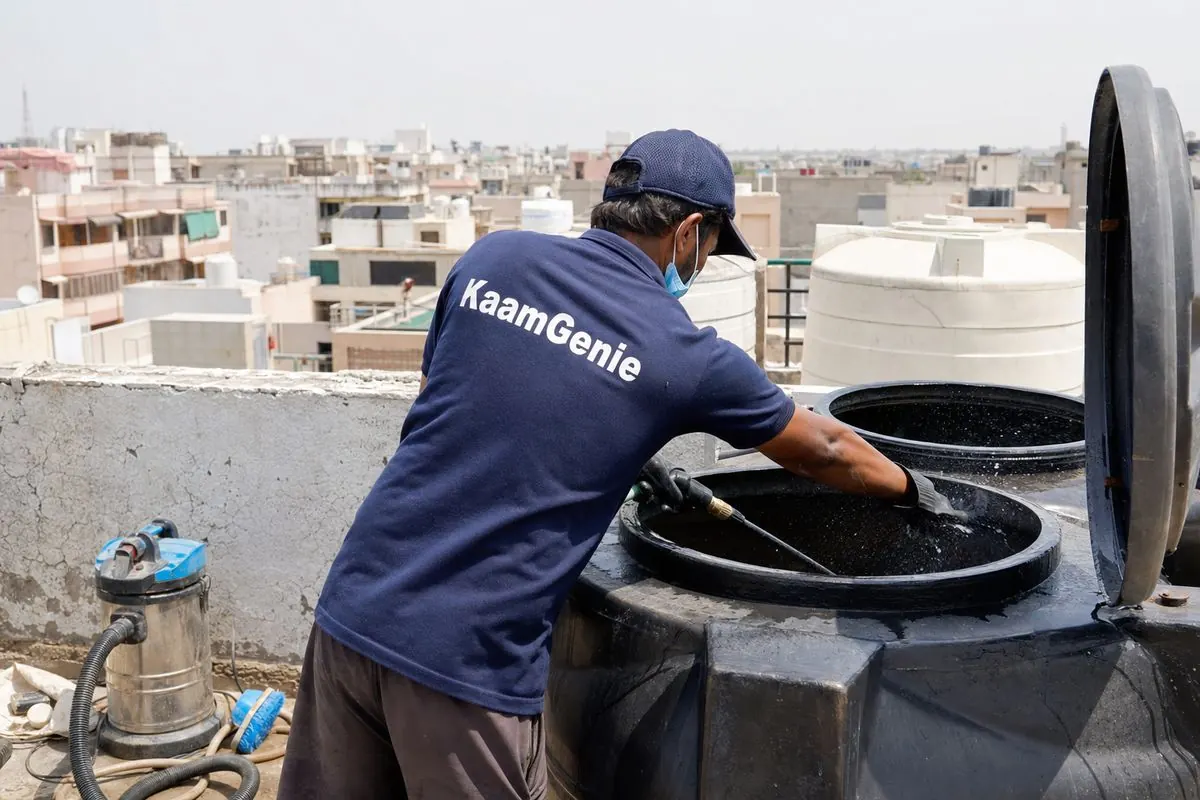 KaamGenie crew cleaning a Sintex / plastic tank in Dwarka Sector 25, Delhi