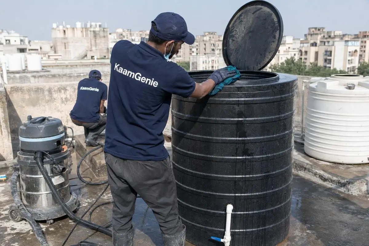 KaamGenie crew cleaning a Sintex / plastic tank in Dwarka Sector 4, Delhi