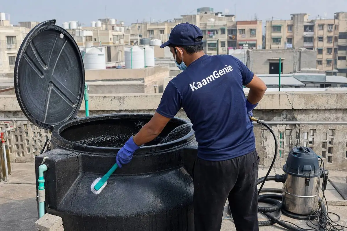 KaamGenie crew cleaning a Sintex / plastic tank in Dwarka Sector 5, Delhi