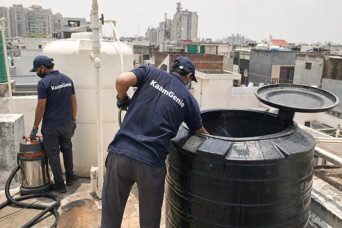 KaamGenie crew cleaning a Sintex / plastic tank in Dwarka Sector 6, Delhi
