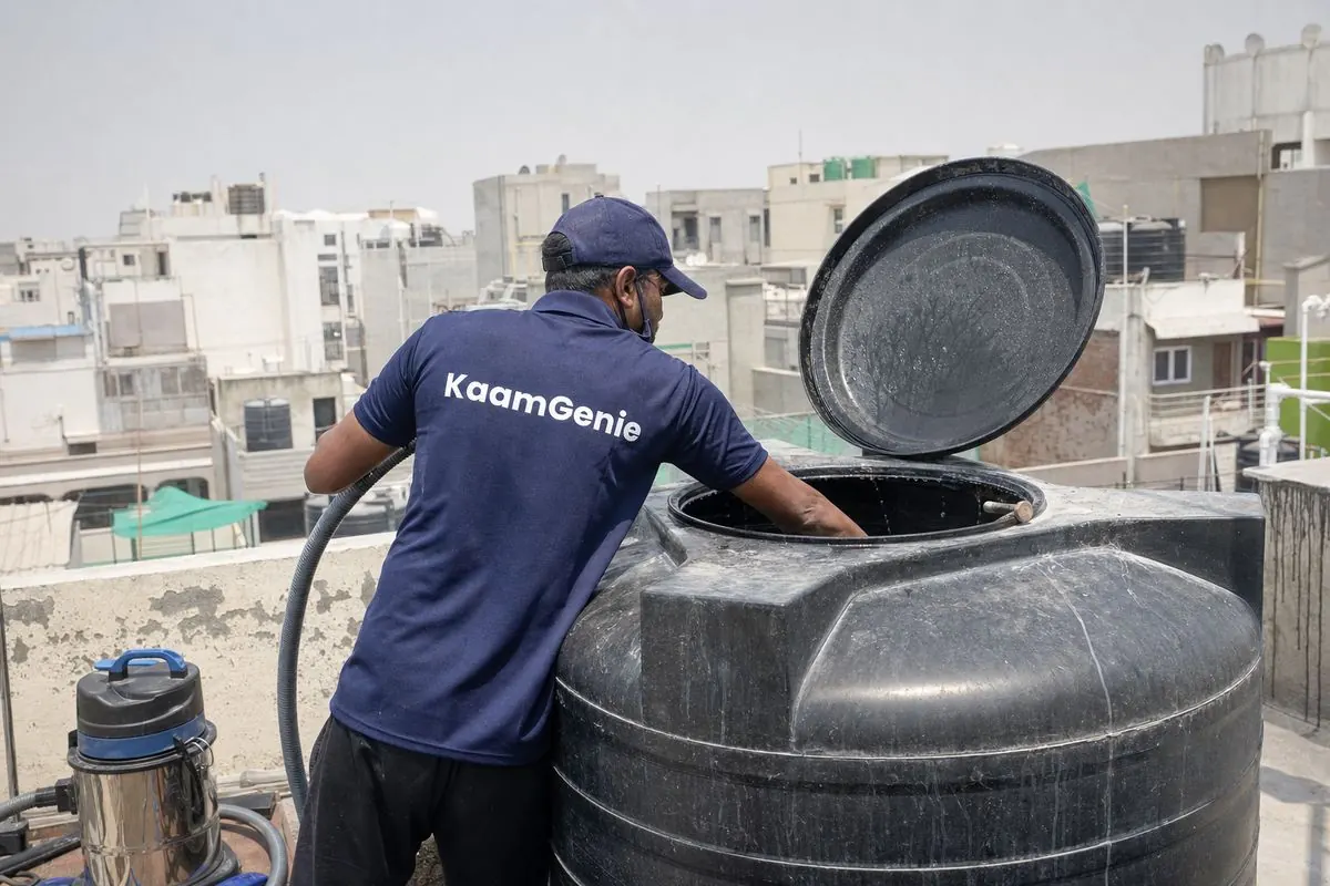 KaamGenie crew cleaning a Sintex / plastic tank in Dwarka Sector 8, Delhi