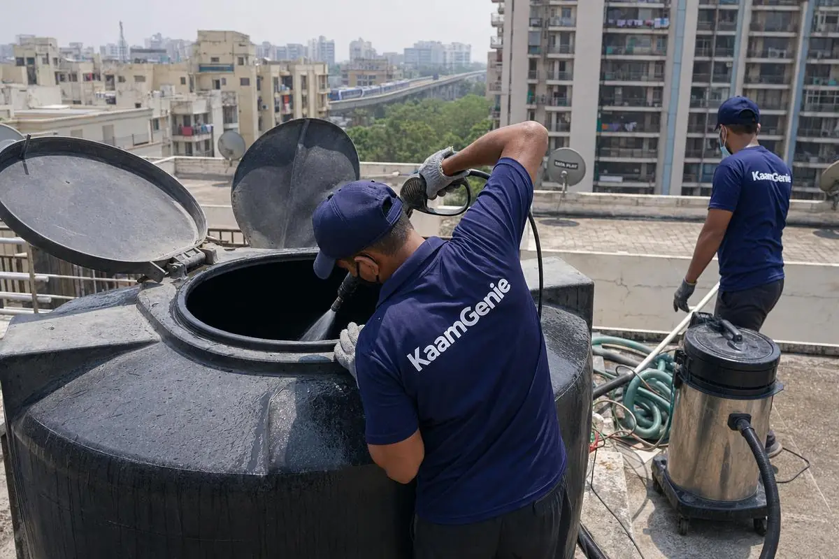 KaamGenie crew cleaning a Sintex / plastic tank in Dwarka Sector 9, Delhi