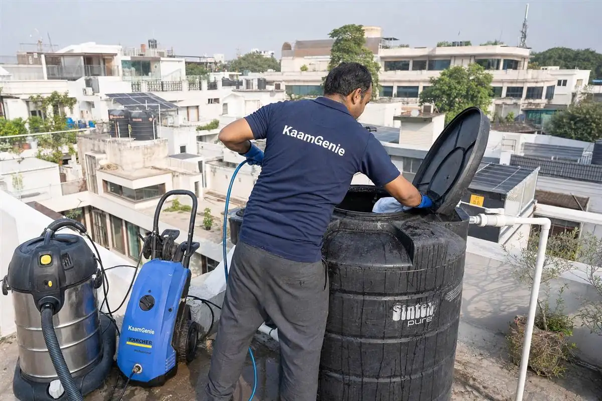 KaamGenie crew cleaning a Sintex / plastic tank in Friends Colony, Delhi