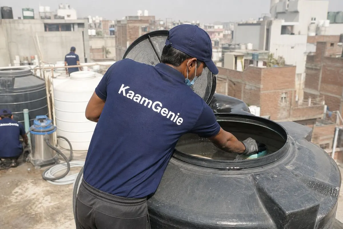 KaamGenie crew cleaning a Sintex / plastic tank in Garhi, Delhi