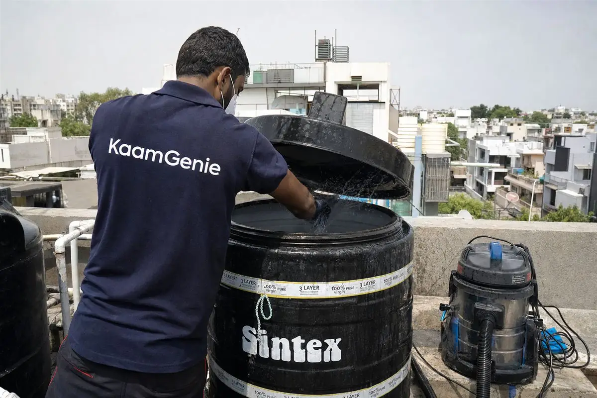 KaamGenie crew cleaning a Sintex / plastic tank in Greater Kailash, Delhi