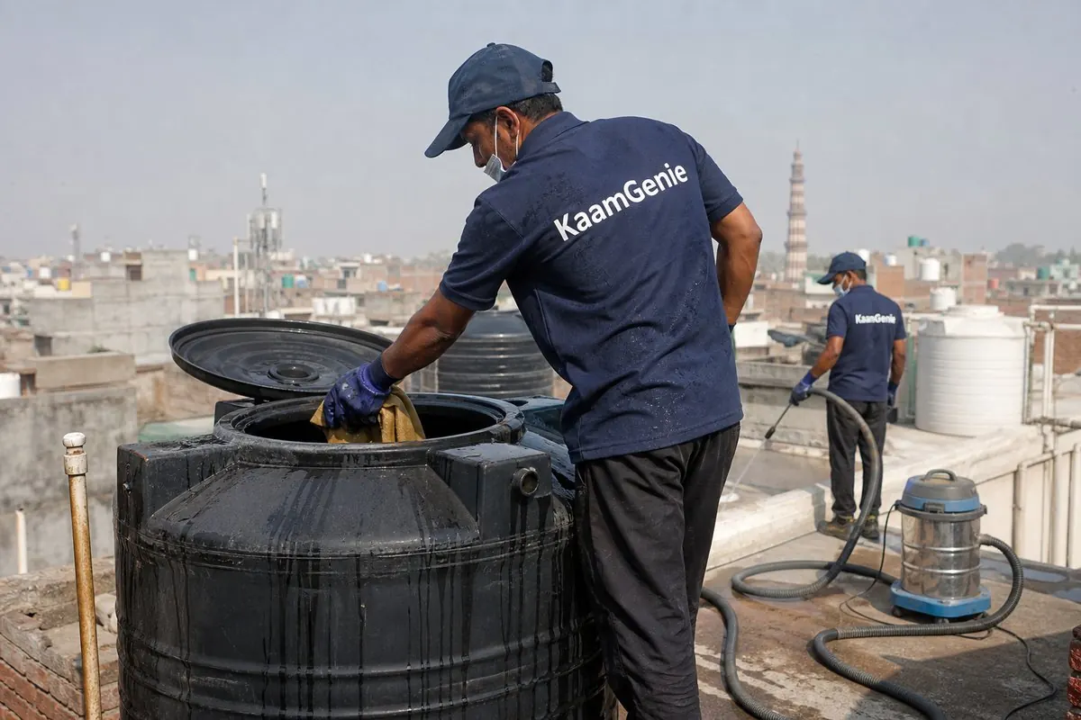 KaamGenie crew cleaning a Sintex / plastic tank in Hastsal, Delhi