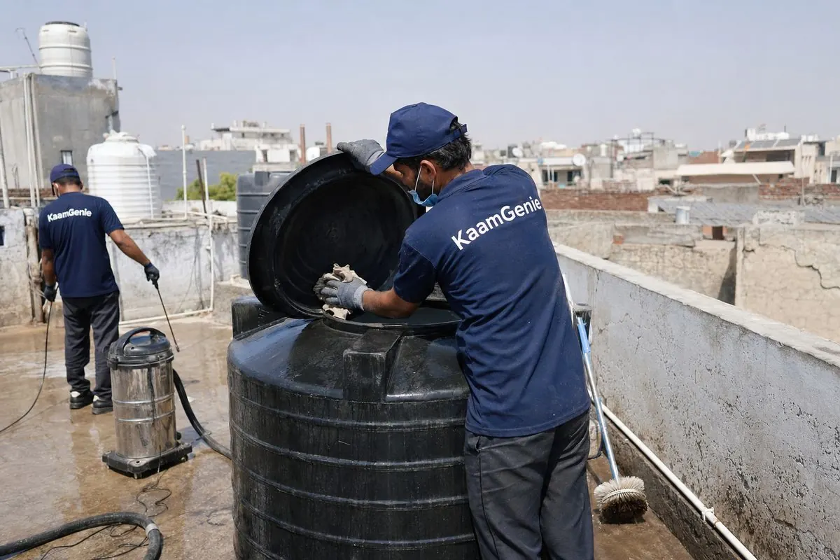 KaamGenie crew cleaning a Sintex / plastic tank in Hauz Rani, Delhi