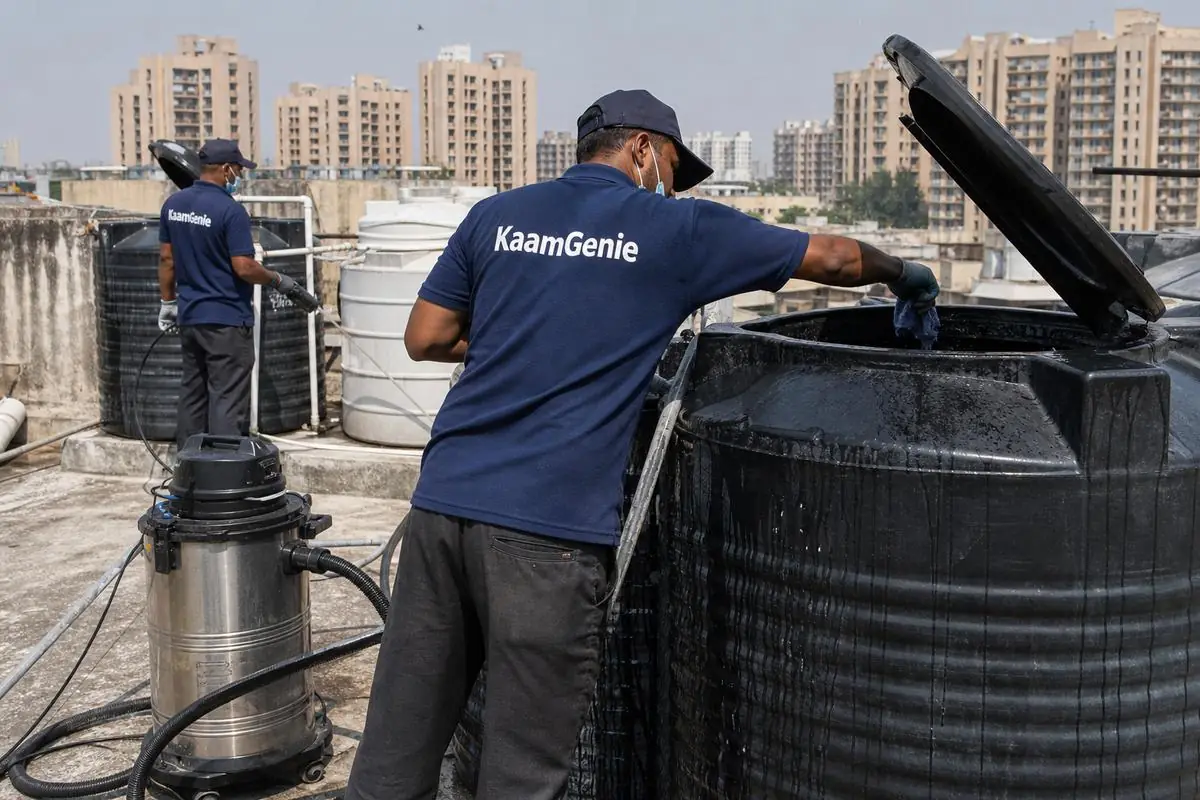 KaamGenie crew cleaning a Sintex / plastic tank in Janakpuri A Block, Delhi