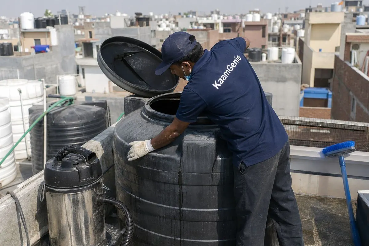 KaamGenie crew cleaning a Sintex / plastic tank in Karawal Nagar, Delhi