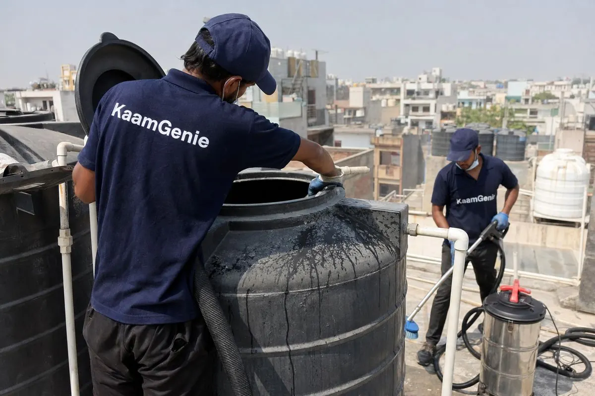KaamGenie crew cleaning a Sintex / plastic tank in Khanpur, Delhi