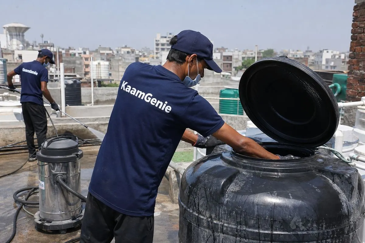 KaamGenie crew cleaning a Sintex / plastic tank in Kilokri, Delhi