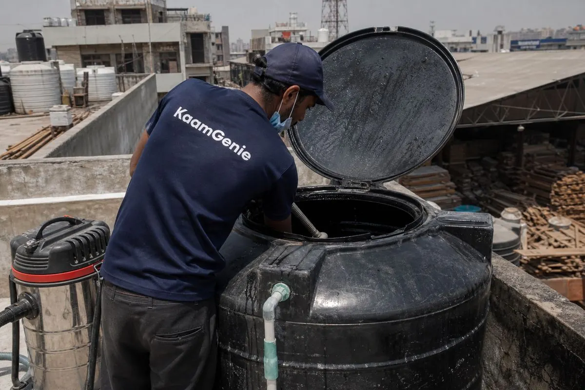 KaamGenie crew cleaning a Sintex / plastic tank in Kirti Nagar, Delhi