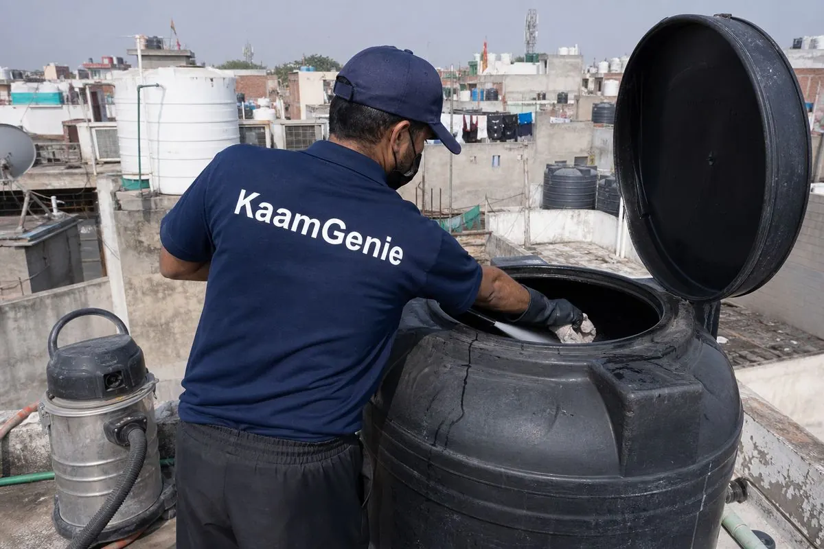KaamGenie crew cleaning a Sintex / plastic tank in Madipur, Delhi