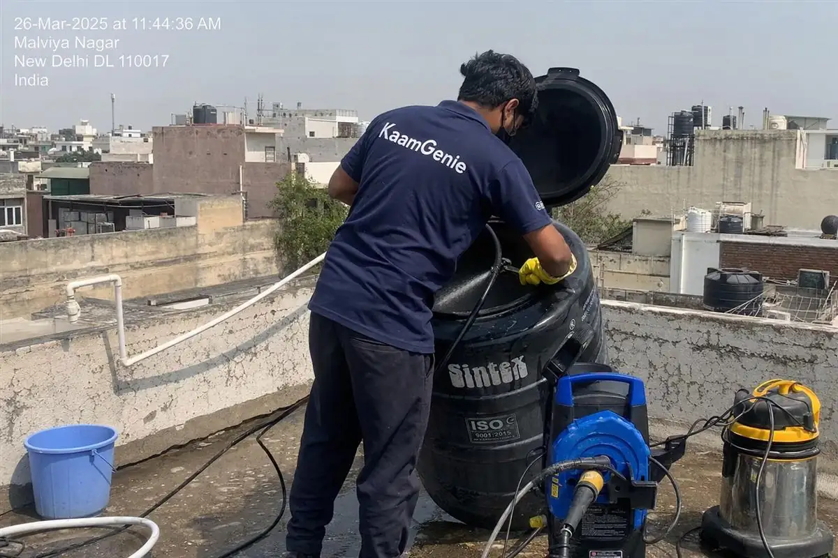 KaamGenie crew cleaning a Sintex / plastic tank in Malviya Nagar, Delhi