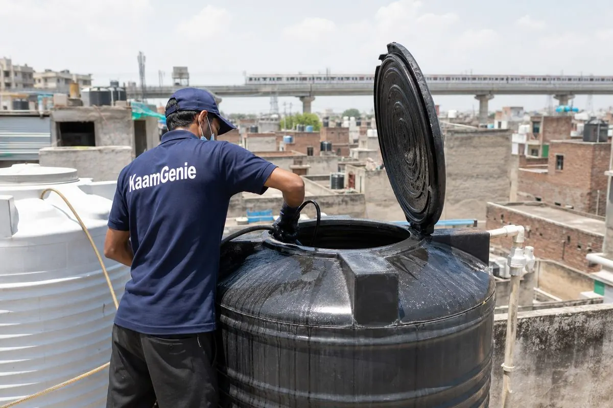 KaamGenie crew cleaning a Sintex / plastic tank in Maujpur, Delhi