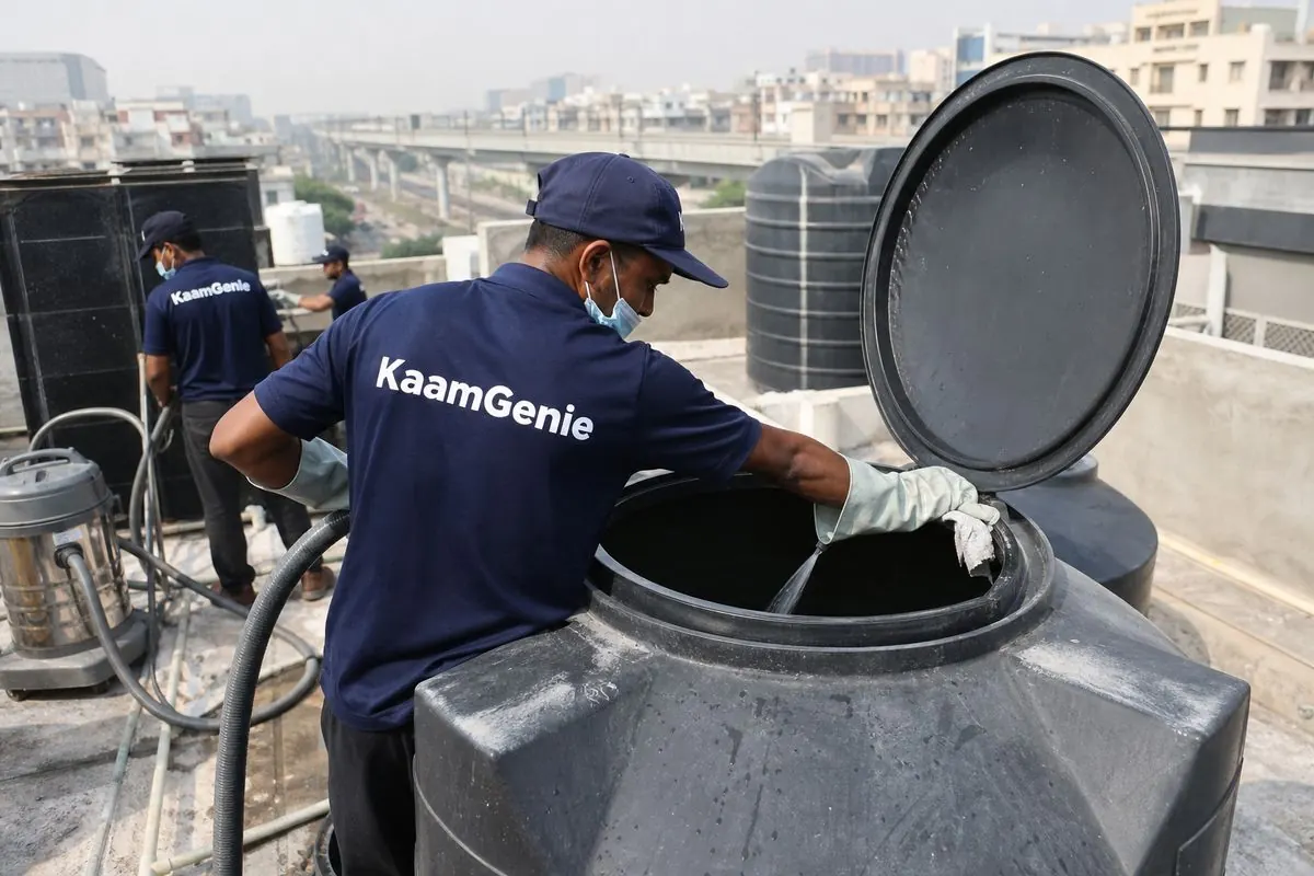 KaamGenie crew cleaning a Sintex / plastic tank in Maurya Enclave, Delhi