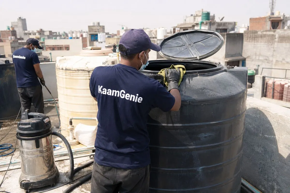 KaamGenie crew cleaning a Sintex / plastic tank in Mujeeb Bagh, Delhi