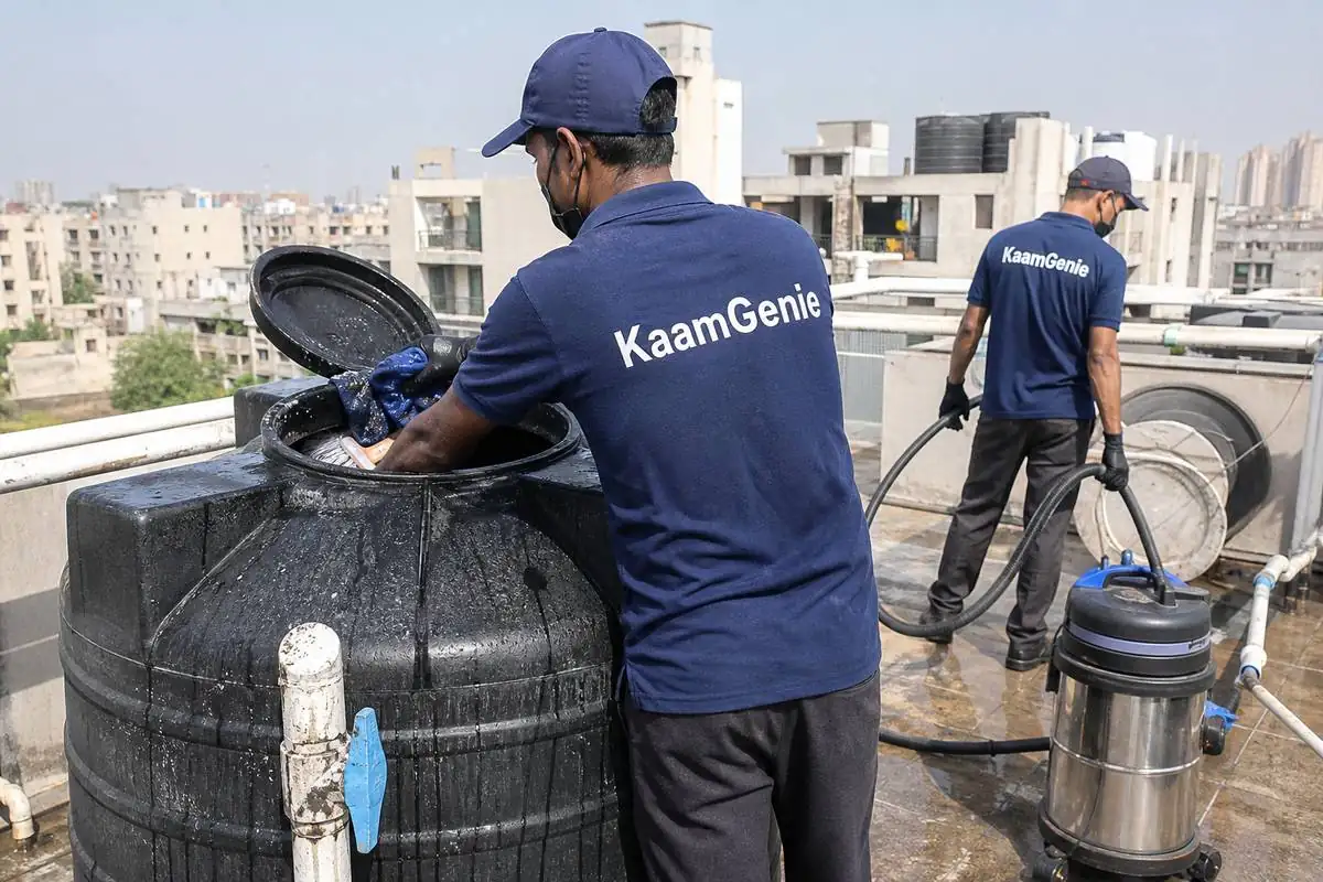 KaamGenie crew cleaning a Sintex / plastic tank in Narela, Delhi