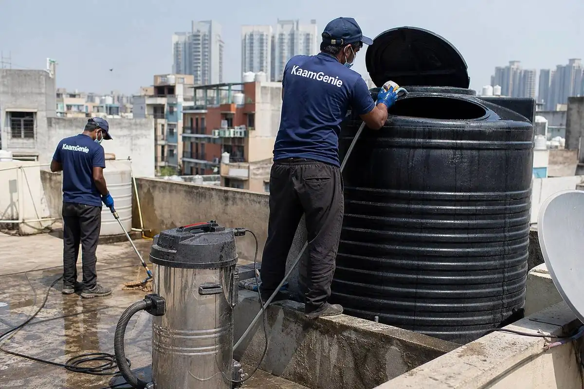 KaamGenie crew cleaning a Sintex / plastic tank in Netaji Nagar, Delhi