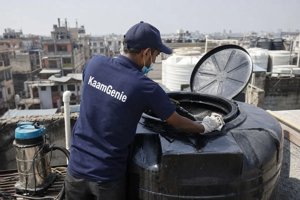 KaamGenie crew cleaning a Sintex / plastic tank in Paharganj, Delhi