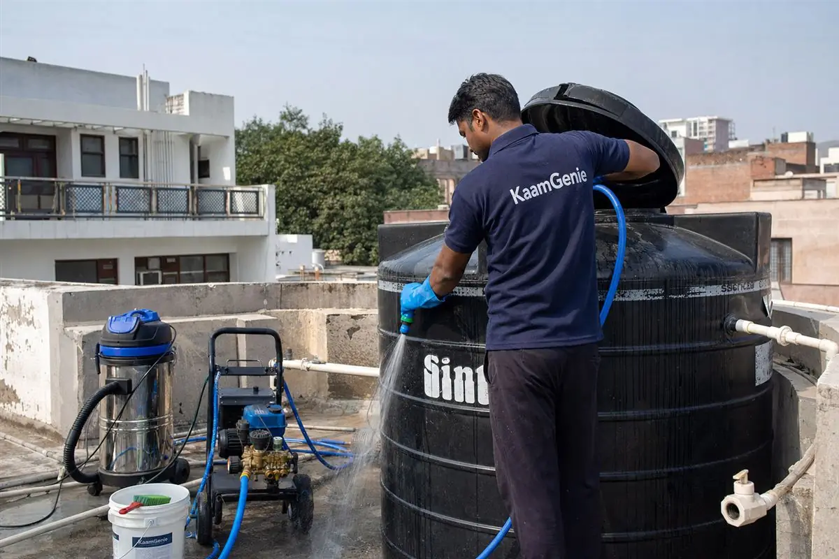 KaamGenie crew cleaning a Sintex / plastic tank in Panchsheel Enclave, Delhi