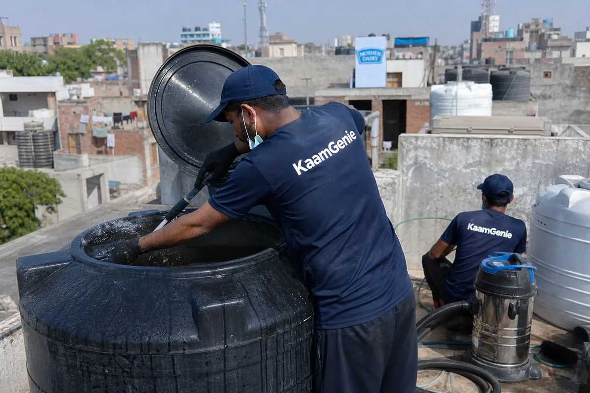 KaamGenie crew cleaning a Sintex / plastic tank in Pandav Nagar, Delhi