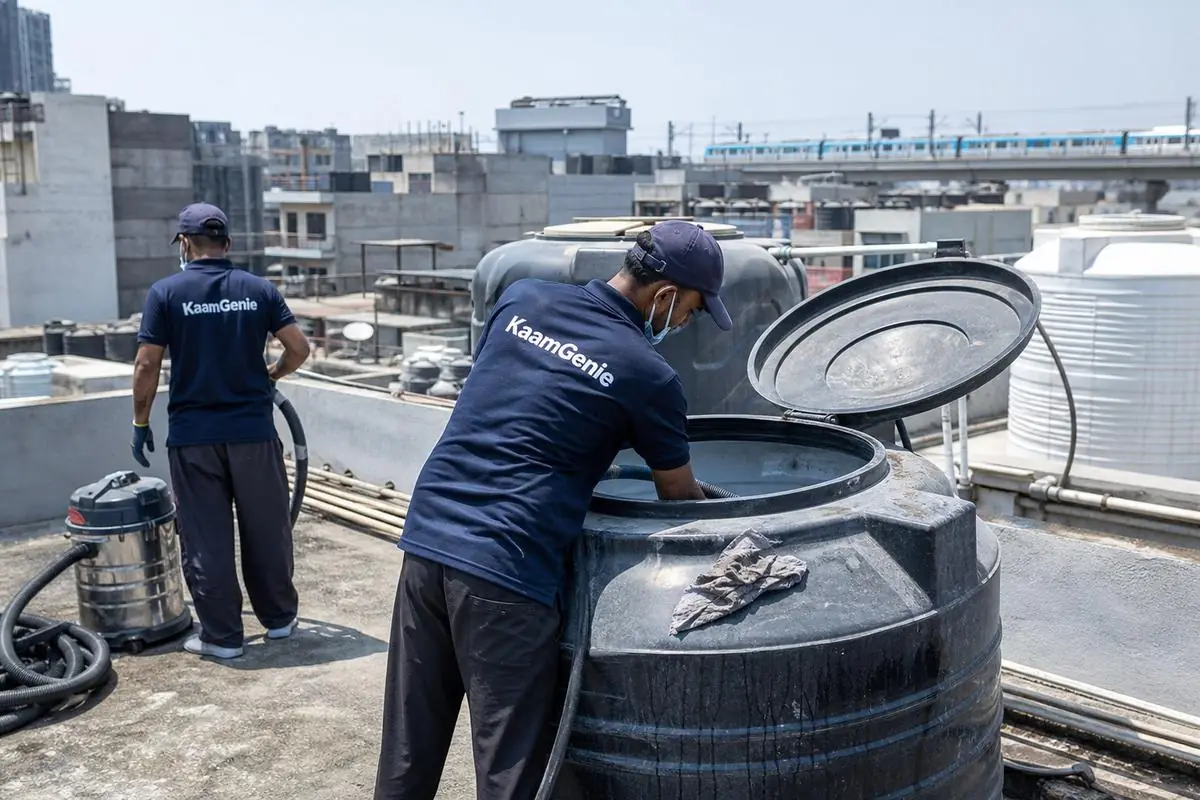 KaamGenie crew cleaning a Sintex / plastic tank in Patel Nagar, Delhi