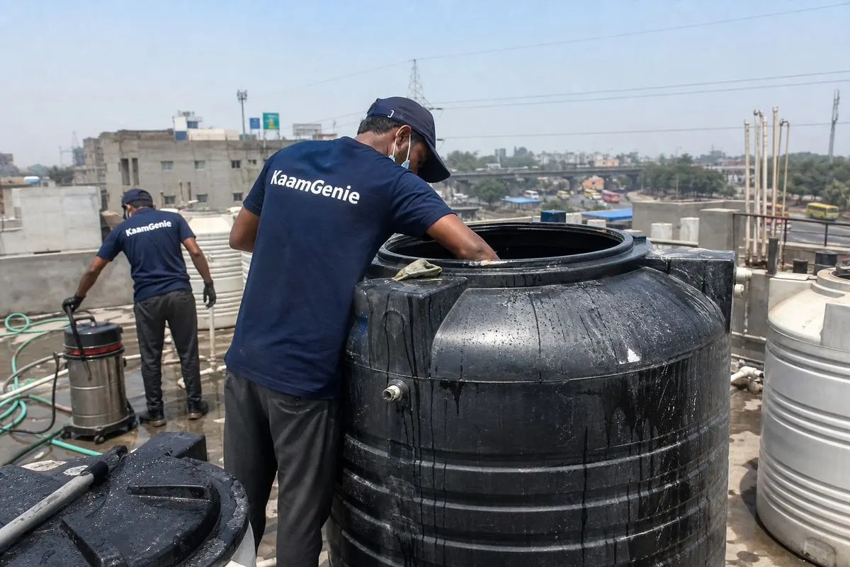 KaamGenie crew cleaning a Sintex / plastic tank in Peeragarhi, Delhi