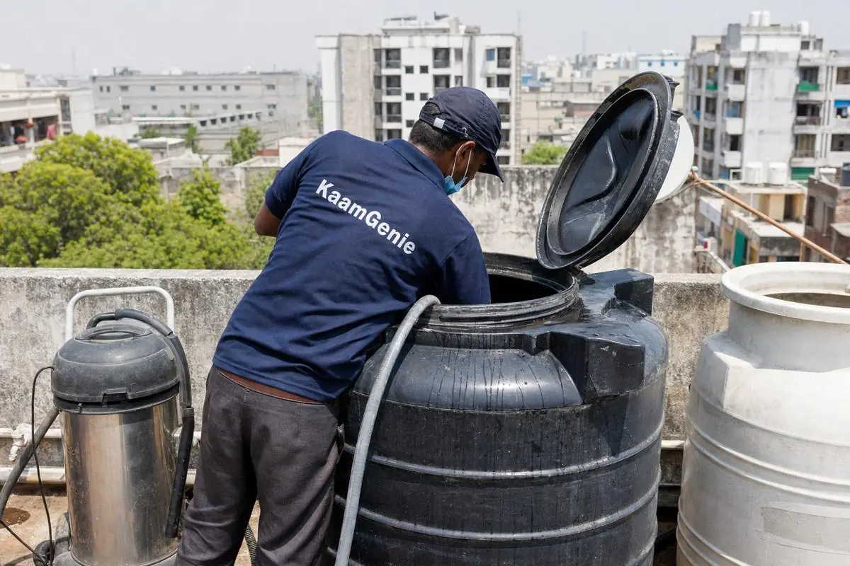 KaamGenie crew cleaning a Sintex / plastic tank in Pragati Vihar, Delhi