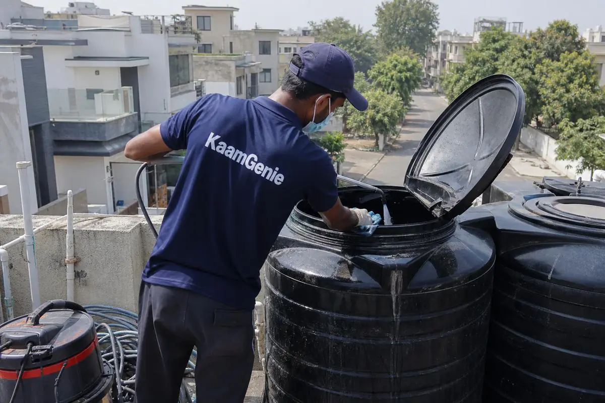 KaamGenie crew cleaning a Sintex / plastic tank in Prashant Vihar, Delhi