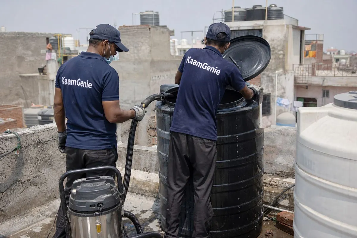 KaamGenie crew cleaning a Sintex / plastic tank in Raghubar Pura, Delhi