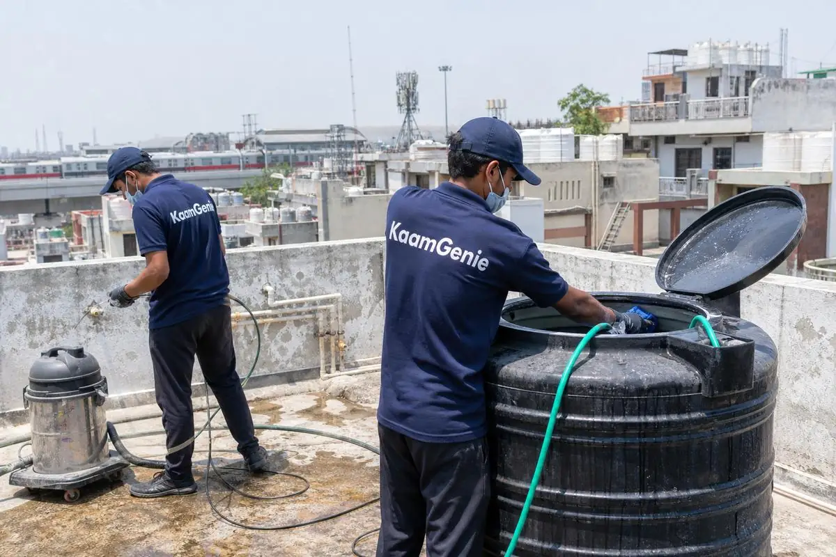 KaamGenie crew cleaning a Sintex / plastic tank in Rajouri Garden, Delhi