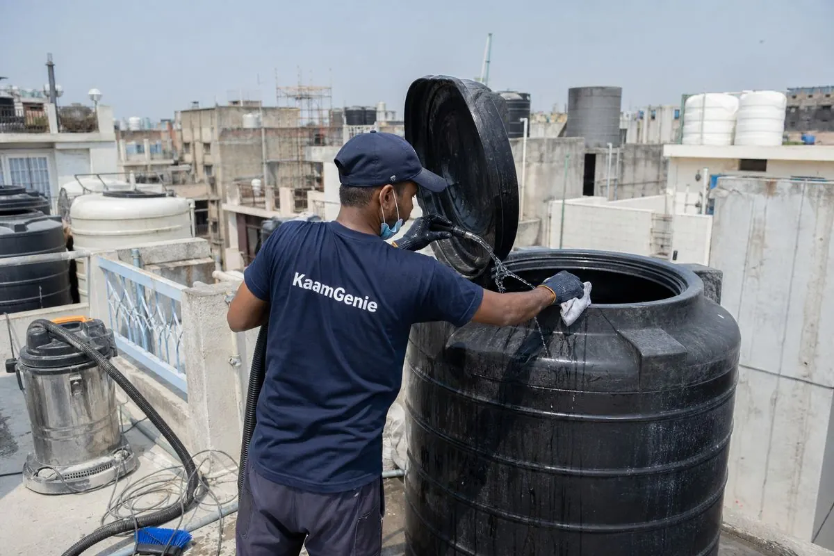KaamGenie crew cleaning a Sintex / plastic tank in Roop Nagar, Delhi