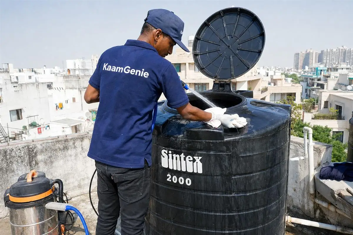 KaamGenie crew cleaning a Sintex / plastic tank in Saket, Delhi