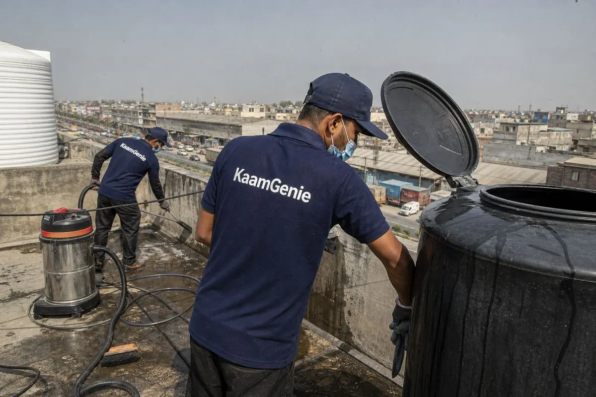 KaamGenie crew cleaning a Sintex / plastic tank in Samaipur, Delhi