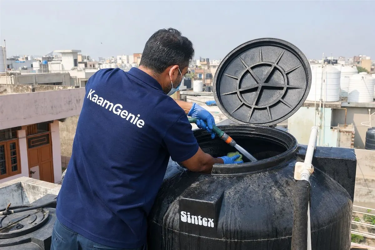 KaamGenie crew cleaning a Sintex / plastic tank in Sarita Vihar, Delhi