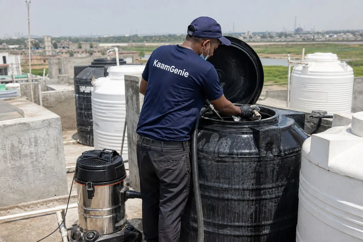 KaamGenie crew cleaning a Sintex / plastic tank in Sonia Vihar, Delhi