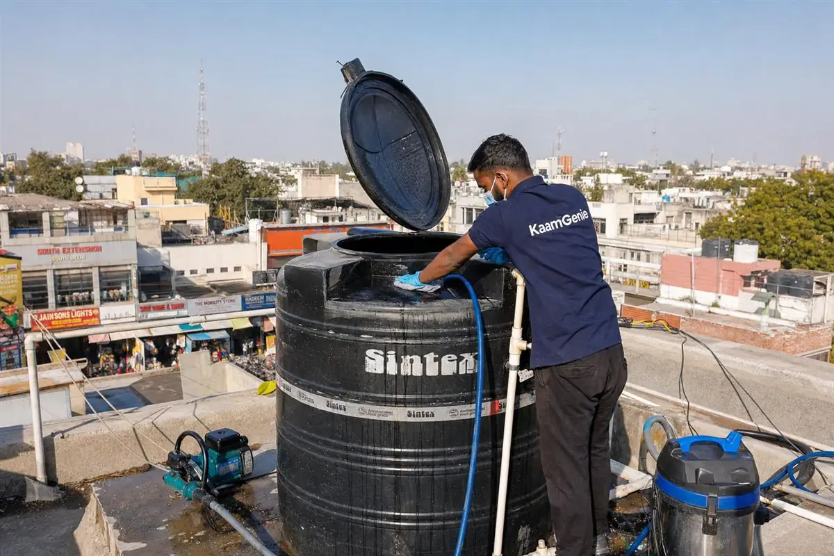 KaamGenie crew cleaning a Sintex / plastic tank in South Extension, Delhi