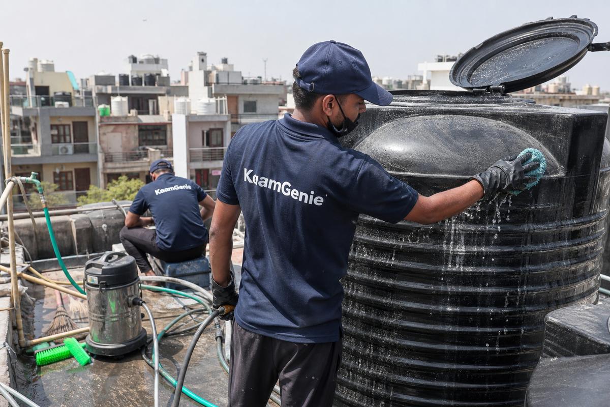 KaamGenie crew cleaning a Sintex / plastic tank in Subhash Nagar, Delhi