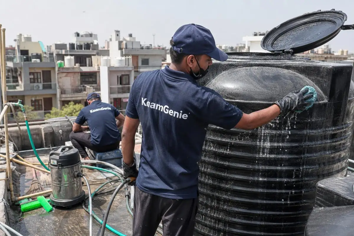 KaamGenie crew cleaning a Sintex / plastic tank in Subhash Nagar, Delhi