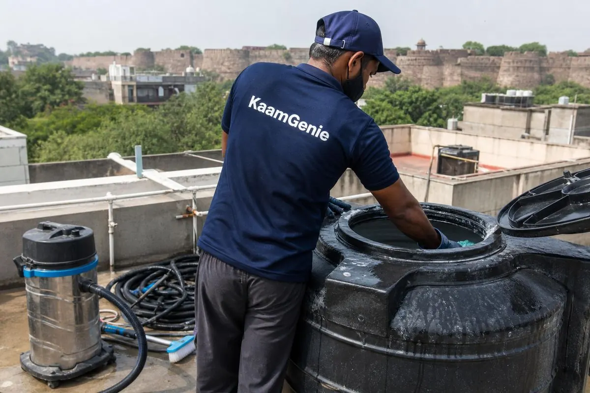 KaamGenie crew cleaning a Sintex / plastic tank in Sundar Nagar, Delhi