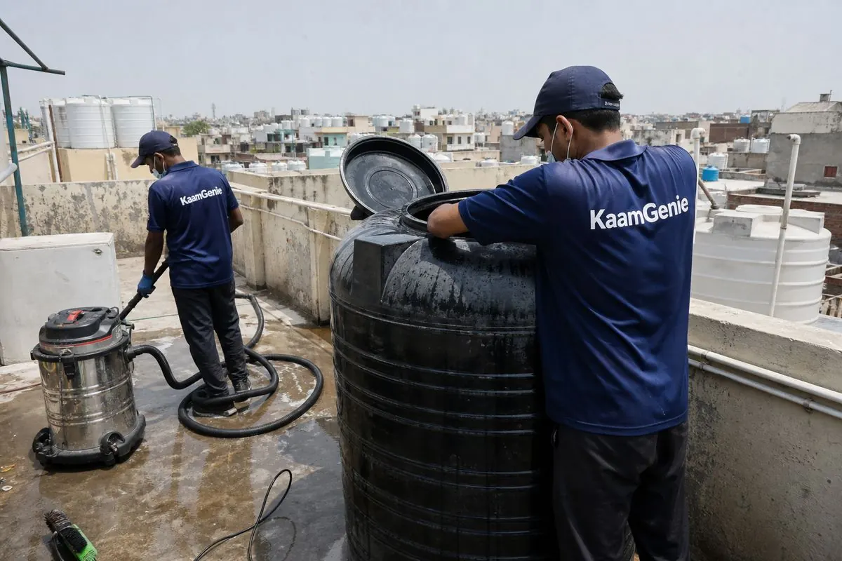 KaamGenie crew cleaning a Sintex / plastic tank in Sunder Vihar, Delhi