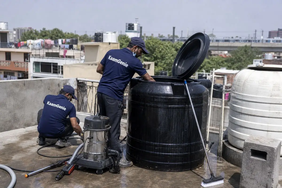 KaamGenie crew cleaning a Sintex / plastic tank in Tagore Garden, Delhi